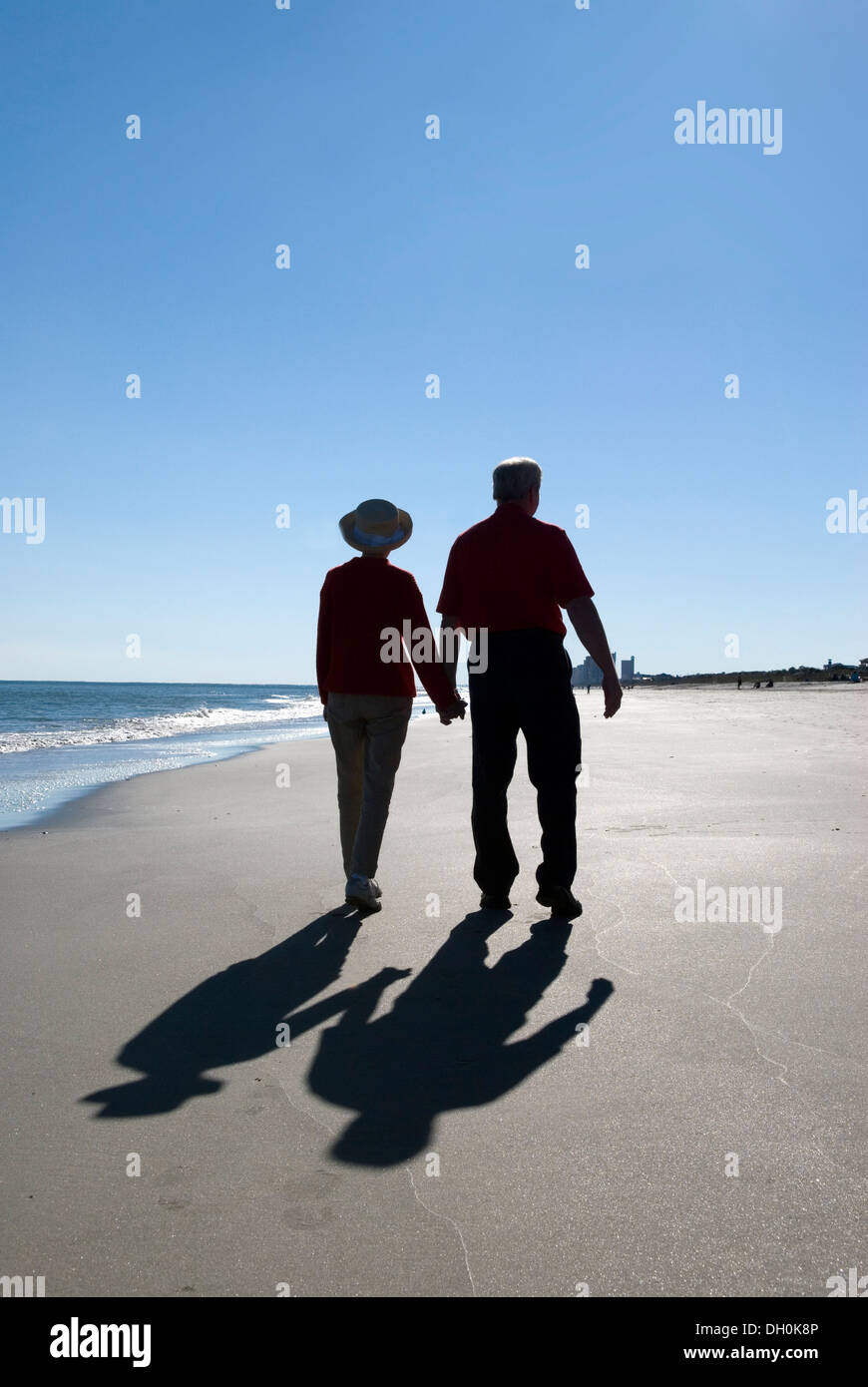 Silhouette couple walking holding hands hi-res stock photography and ...