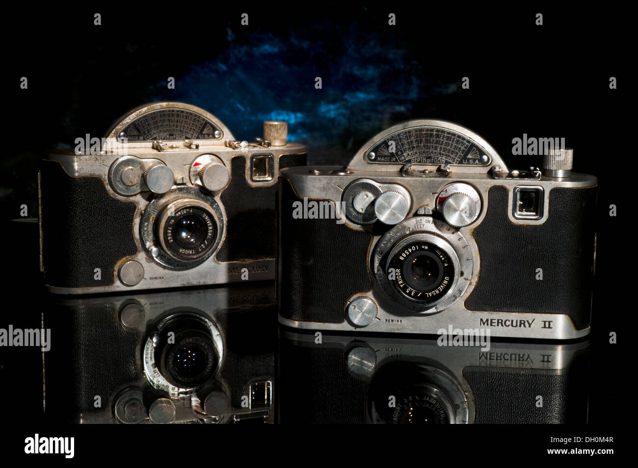 Two vintage 1940's and 1950's Mercury II film cameras with dark background & reflection Stock Photo