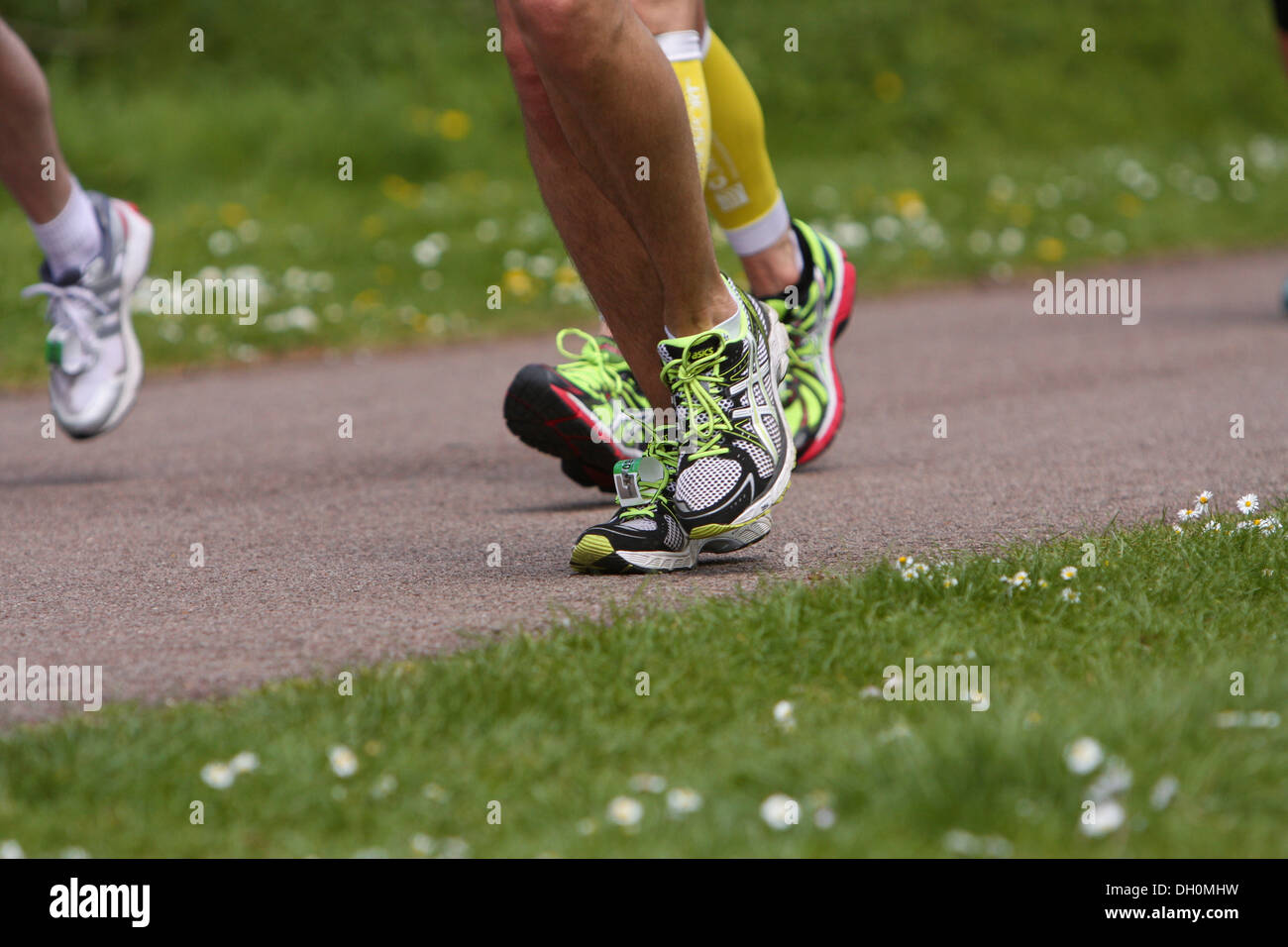 Three 3 marathon runners feet in motion Stock Photo Alamy