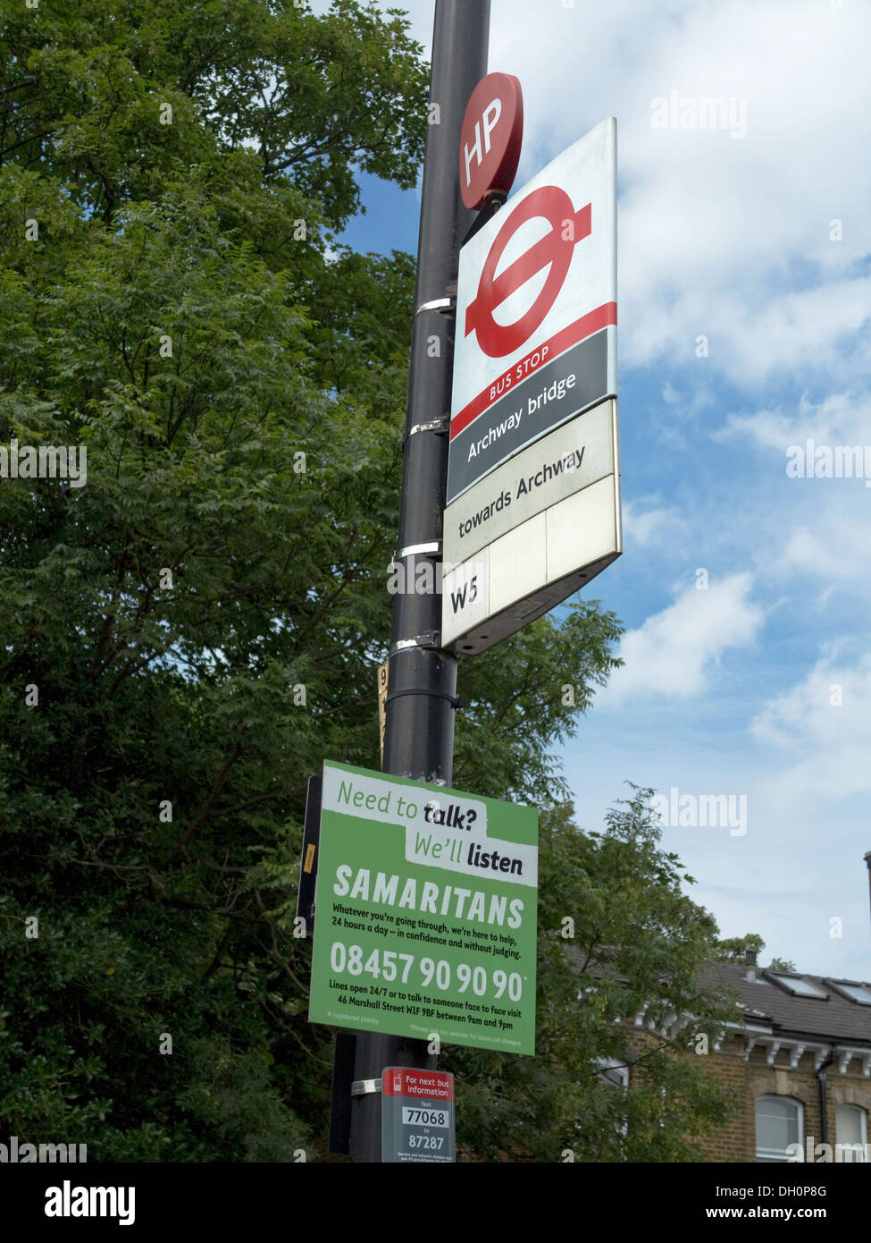 Samaritans charity sign at bus stop by so-called 'Suicide Bridge' over Archway Road, Highgate, north London Stock Photo