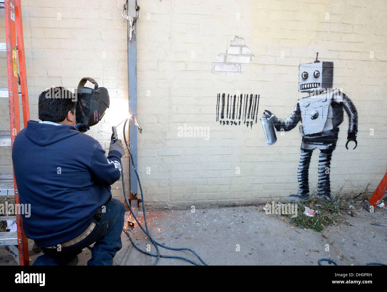 New York, NY, USA. 28th Oct, 2013. Banksy on location for Graffiti Artist Banksy  Tags Robot with Barcode and Pigeon in Coney Island, Stillwell and Neptune  Avenues, New York, NY October 28,