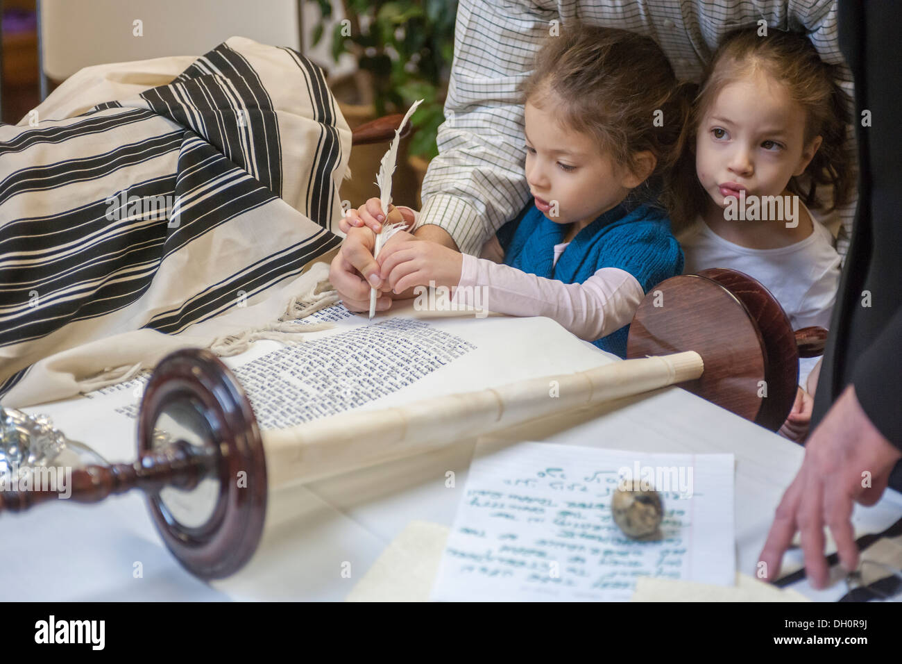 Sofer finishes final letters the Chabad of Harlem's Sefer Torah in