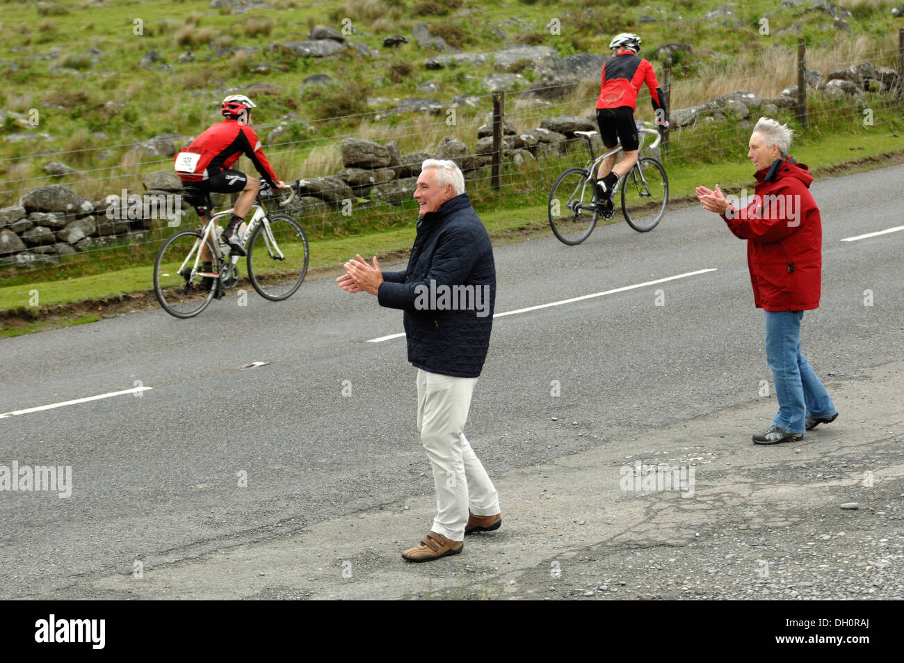 Supporters clapping and chearing on riders in the Dartmoor classic cyclosportive 2013 Stock Photo