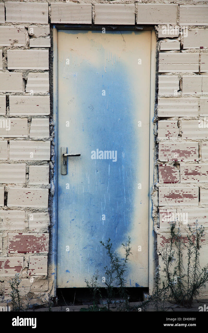 Metal door two tone in brick wall Stock Photo