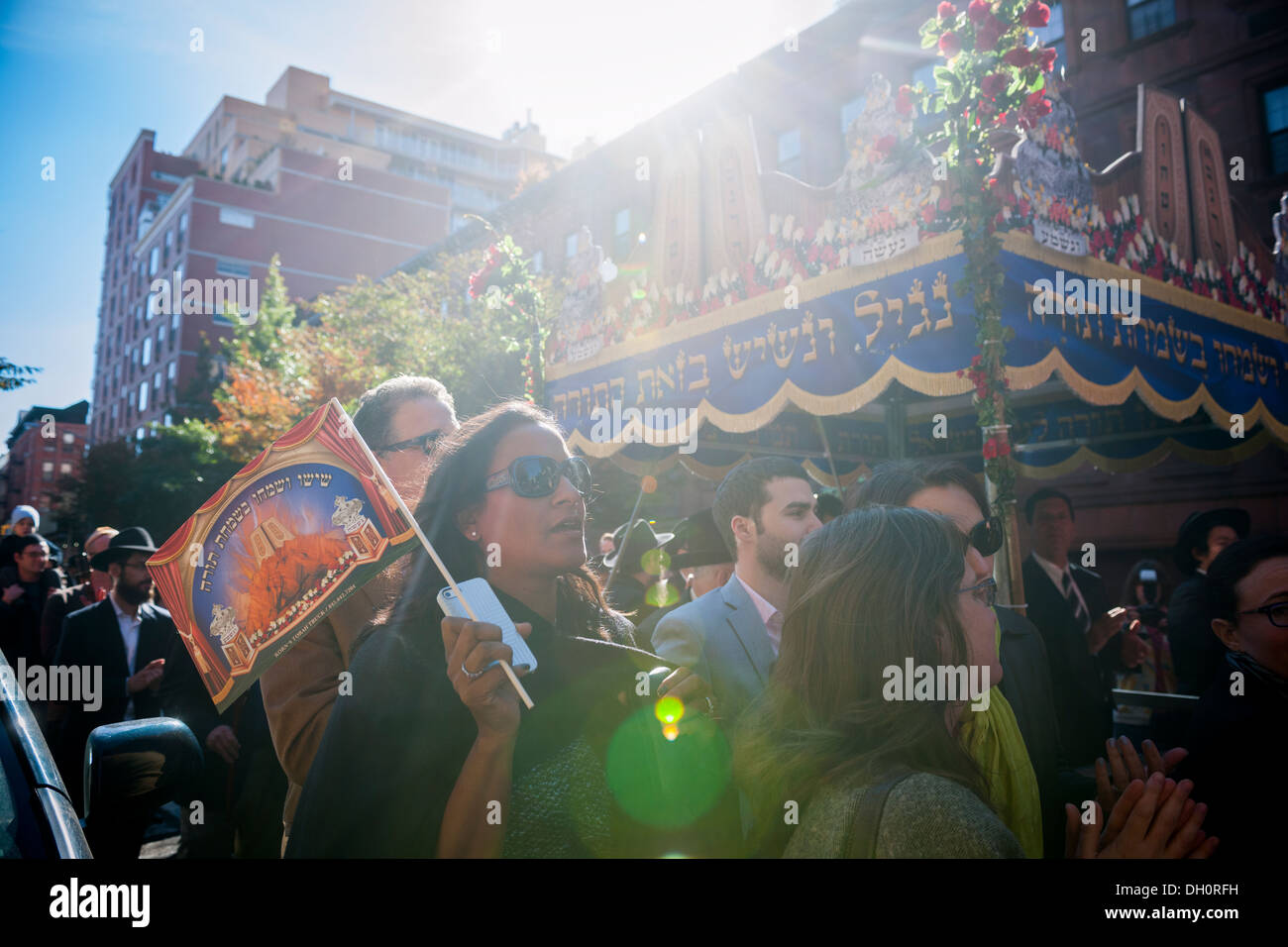 Members and friends of the Chabad of Harlem celebrate the completion of their Sefer Torah Stock Photo