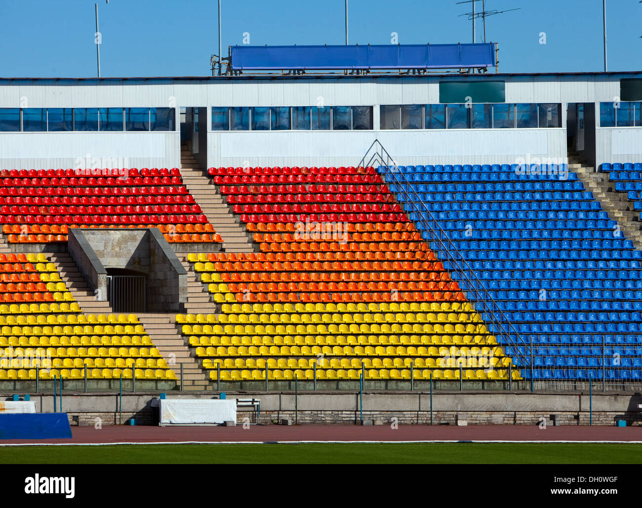 Empty rows of seats at football stadium Stock Photo