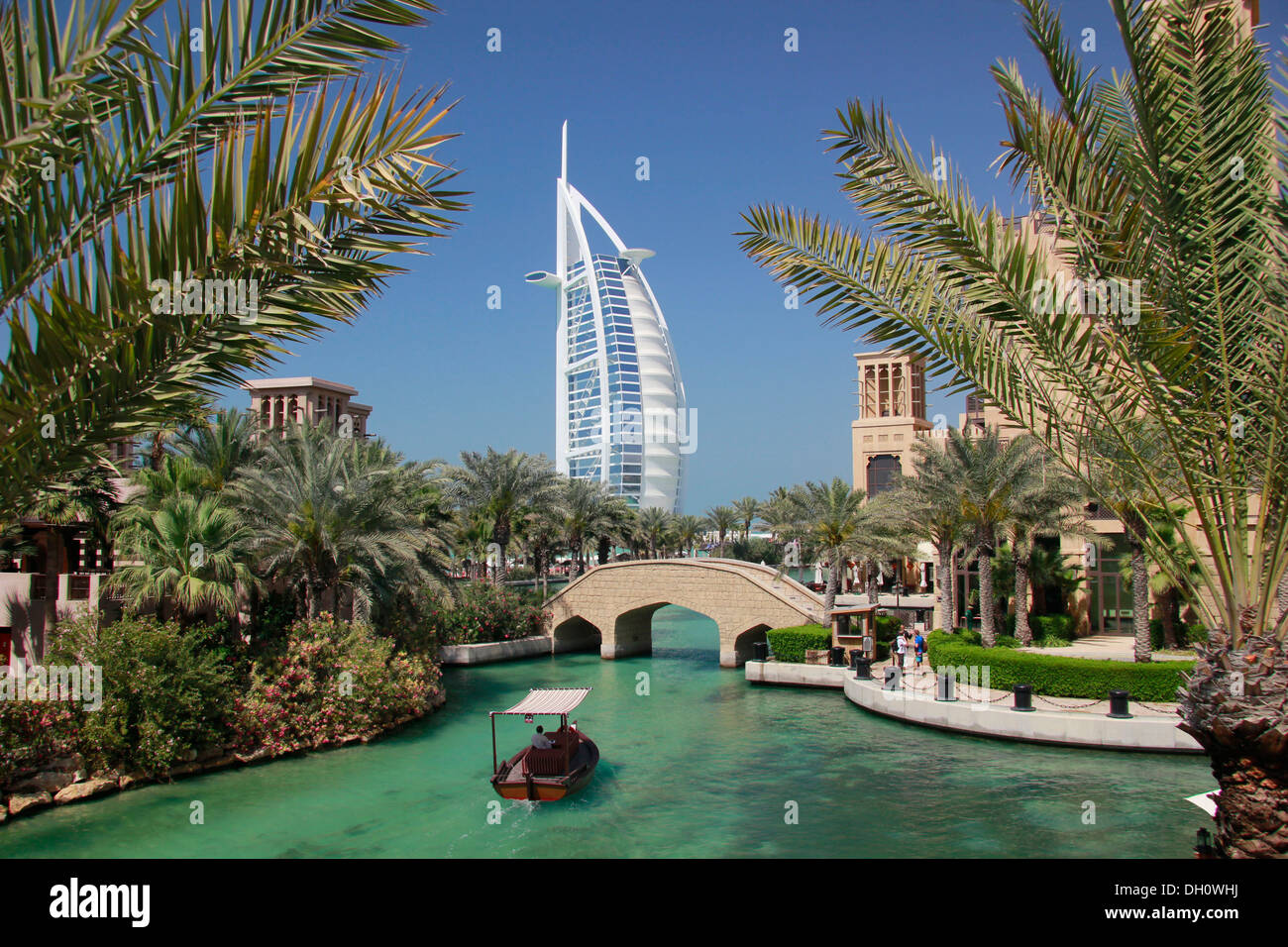 Water channel at Madinat Jumeirah, Burj al Arab luxury hotel at back, Burj al Arab, Dubai, United Arab Emirates Stock Photo