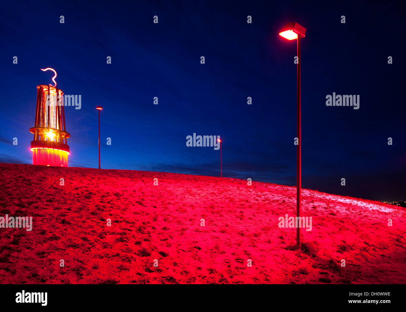 Geleucht, sculpture in the form of a miner's lamp, illuminated on Rheinpreussen slag heap in winter, Meerbeck, Moers Stock Photo