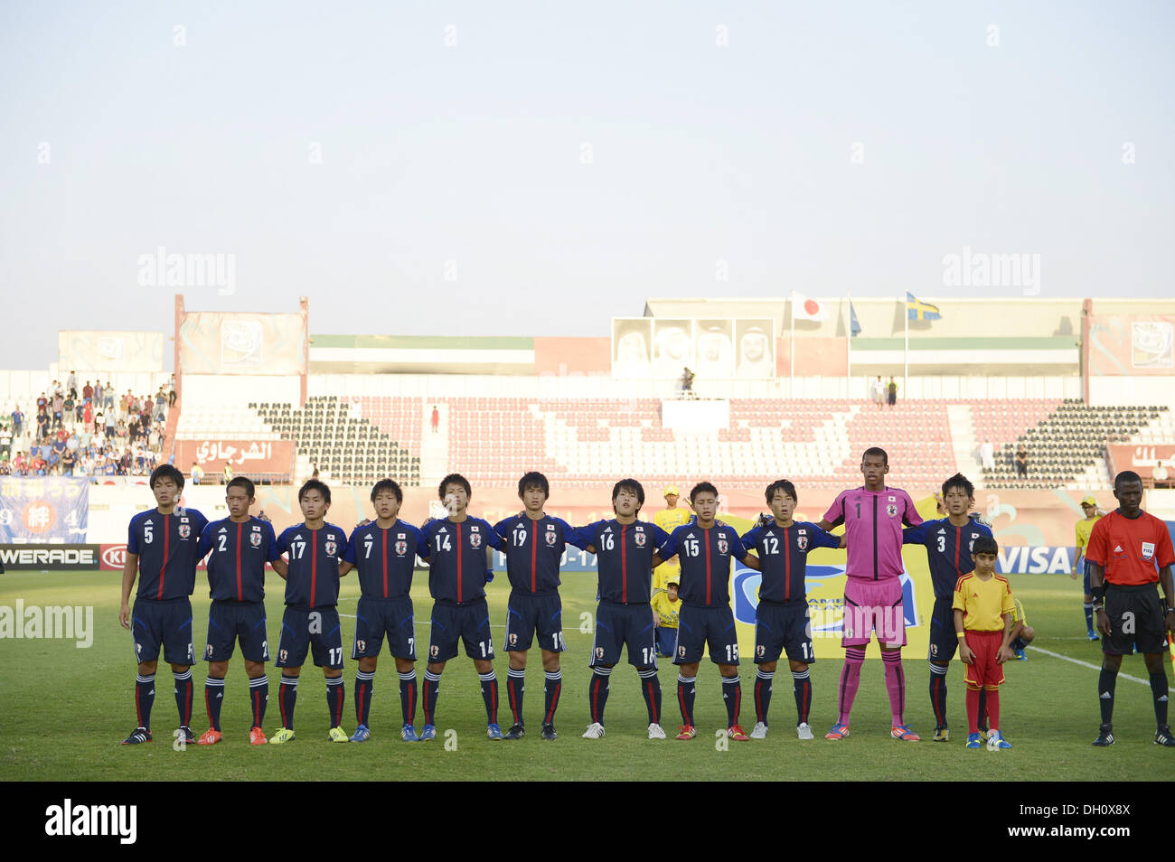 Sharjah, United Arab Emirates. 28th Oct, 2013. U-17Japan team group line-up (JPN) Football / Soccer : Players of Japan sing the national anthem before the FIFA U-17 World Cup UAE 2013 Round of 16 match between Japan 1-2 Sweden at Sharjah Stadium in Sharjah, United Arab Emirates . © FAR EAST PRESS/AFLO/Alamy Live News Stock Photo