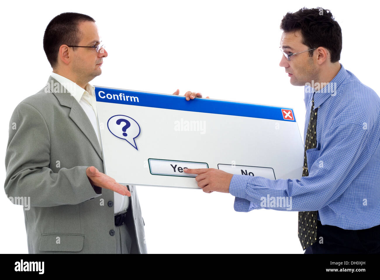Customer support helping client to make a decision. Two mans with Confirm plate, the helper points Yes. Copy space on the plate Stock Photo