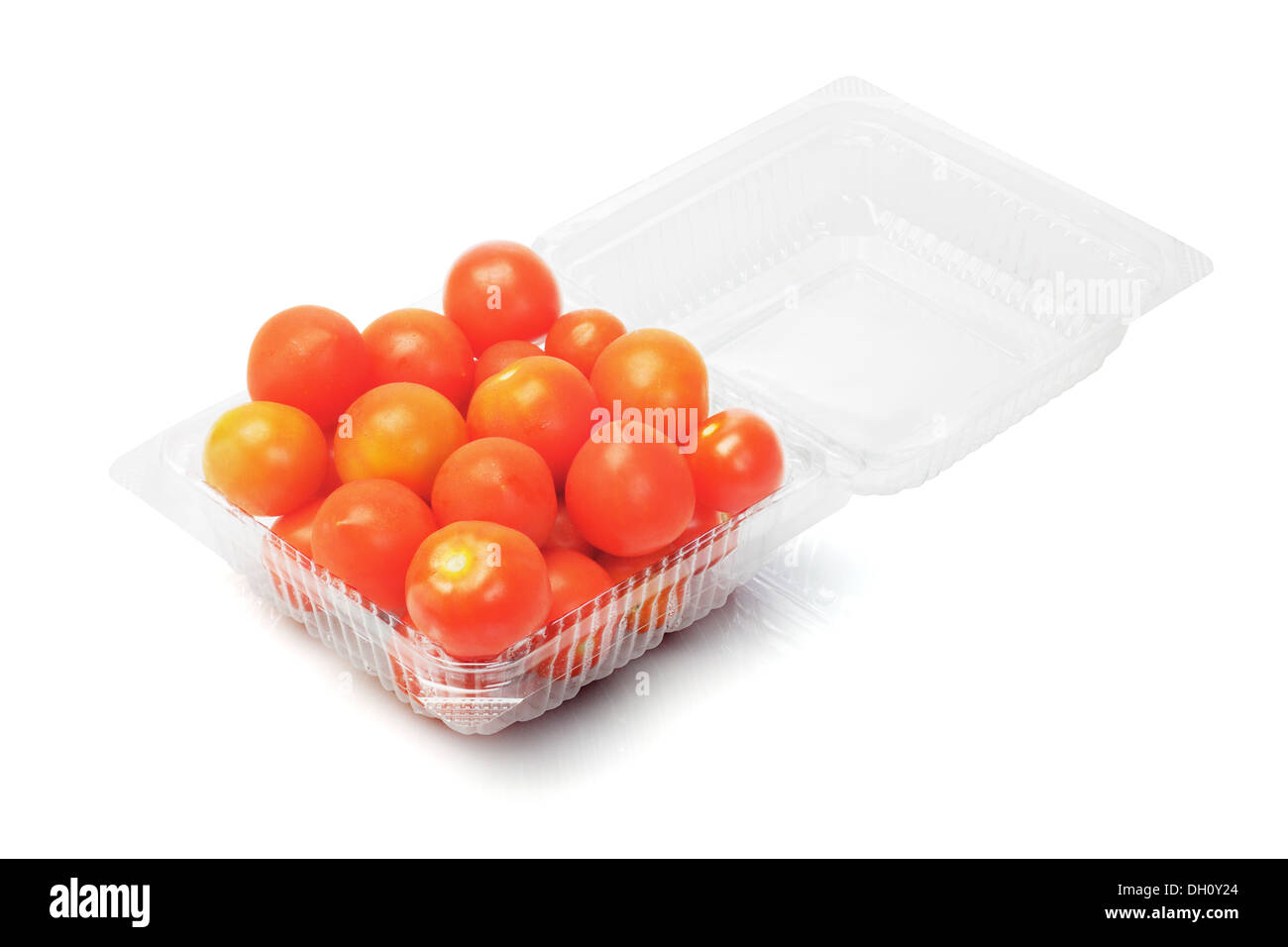 Plum Tomatoes In Open Plastic Box On White Background Stock Photo