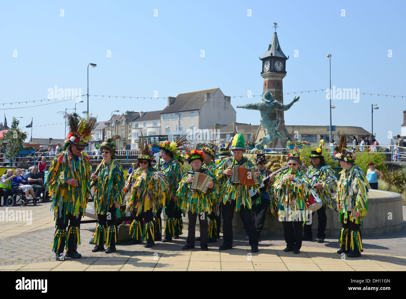 Morris dancing troupe performing on seafront promenade, Skegness, Lincolnshire, England, United Kingdom Stock Photo