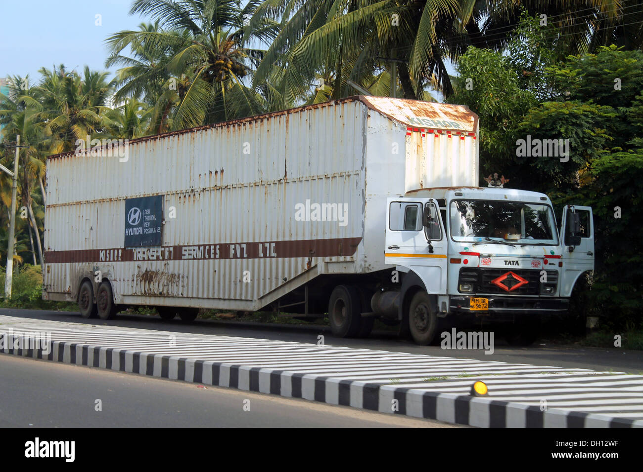 Truck for carrying Hyundai cars to showroom parked at the roadside in Kerala Stock Photo