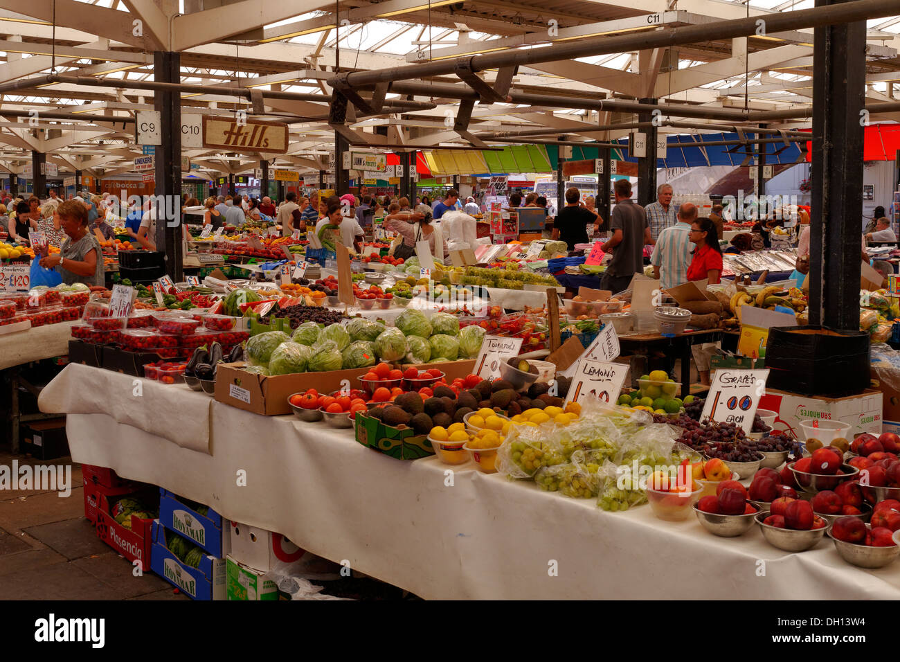 Busy fruit and veg market stalls, Leicester covered market, Leicester, England, UK Stock Photo