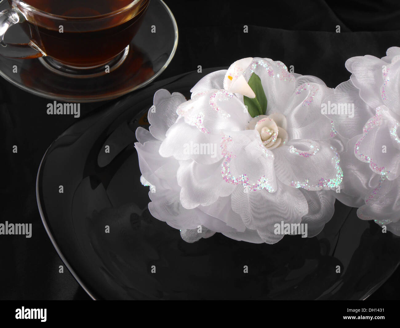 hot cup of tea or coffee with holiday gift bow ribbon Stock Photo