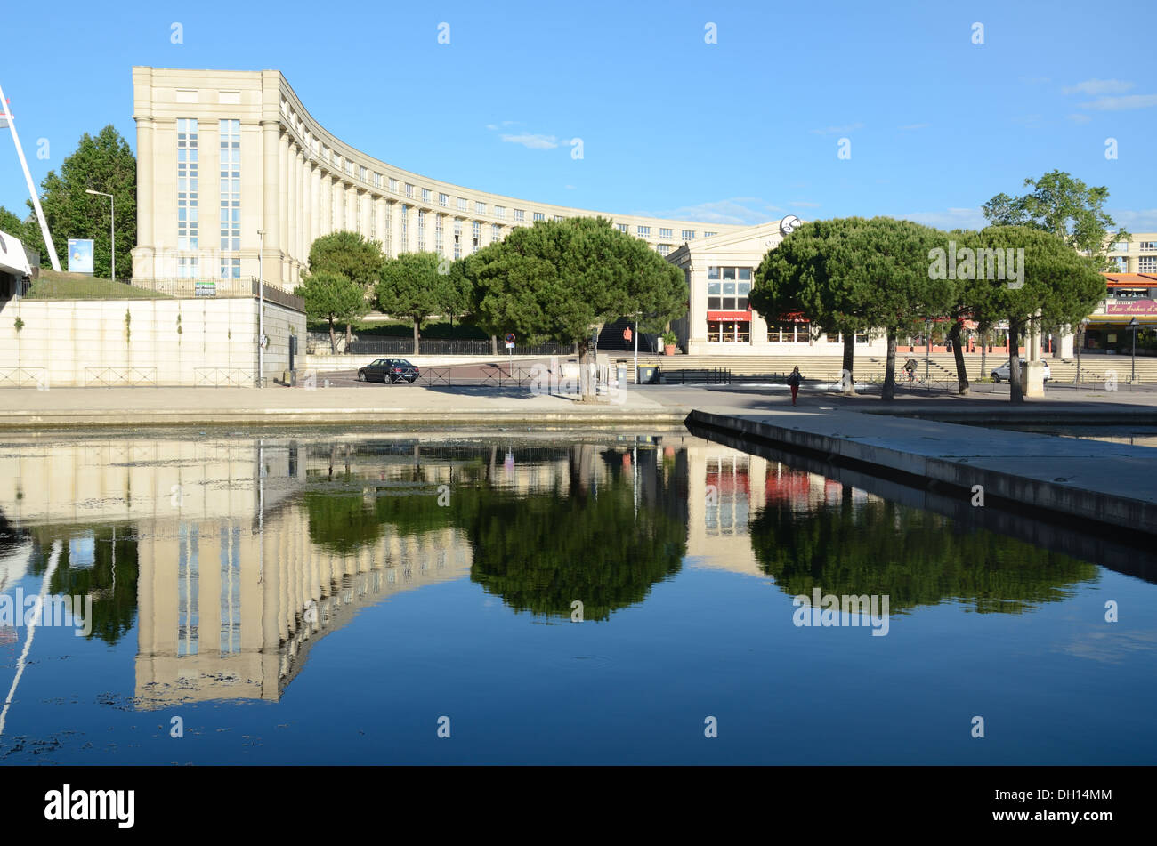 Postmoder, Post-Modern Neoclassical Apartment Building on the Esplanade Europe Antigone by Ricardo Bofill, Reflected in River Lez, Montpellier France Stock Photo