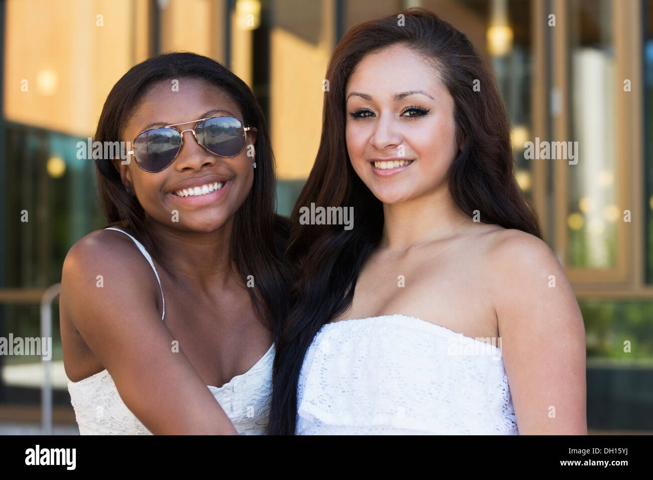Teenage girls smiling outdoors Stock Photo