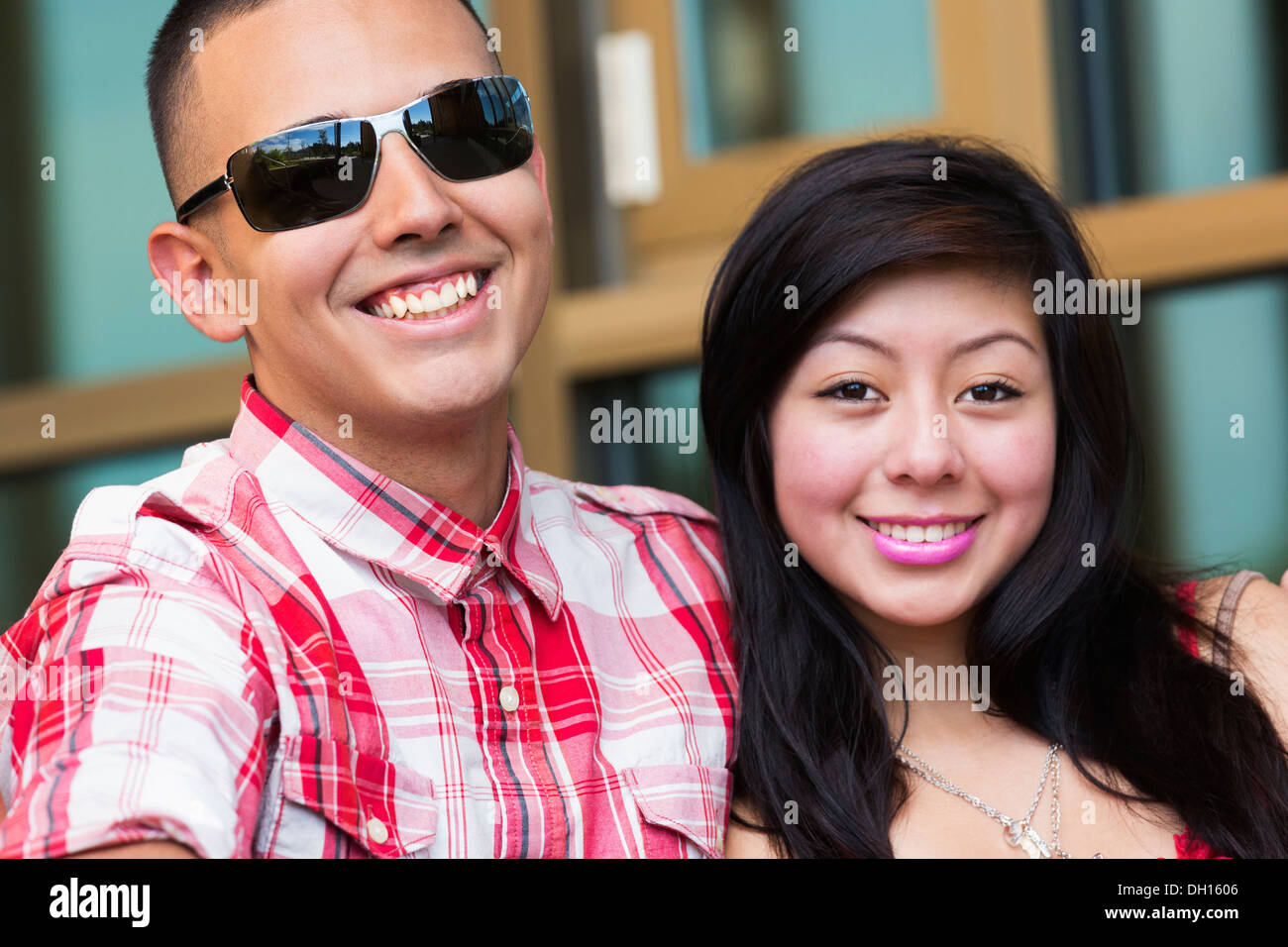 Hispanic couple smiling outdoors Stock Photo
