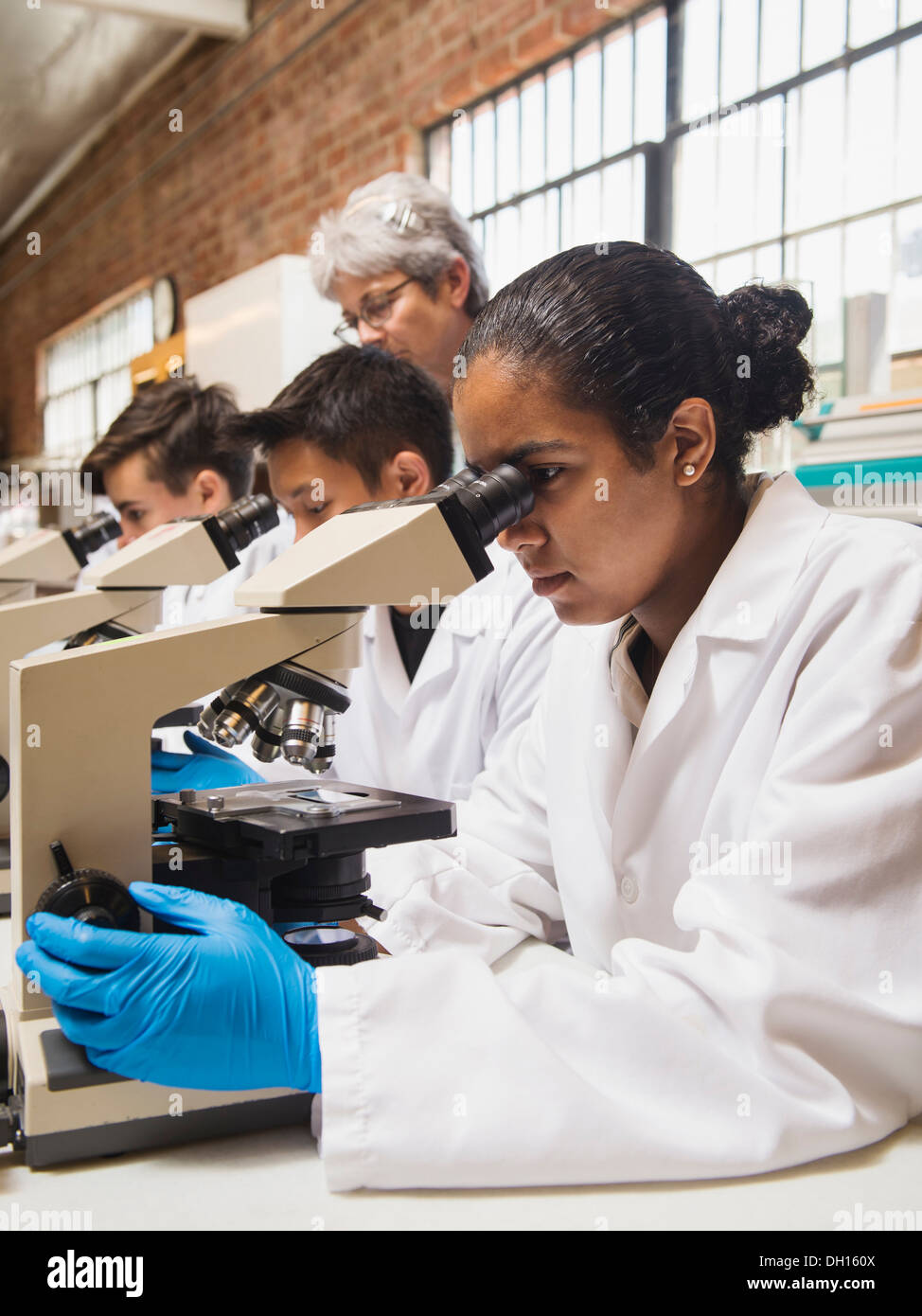 Students working in science lab Stock Photo