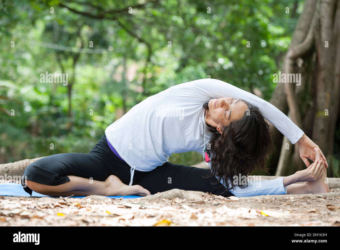 Hispanic woman practicing yoga Stock Photo