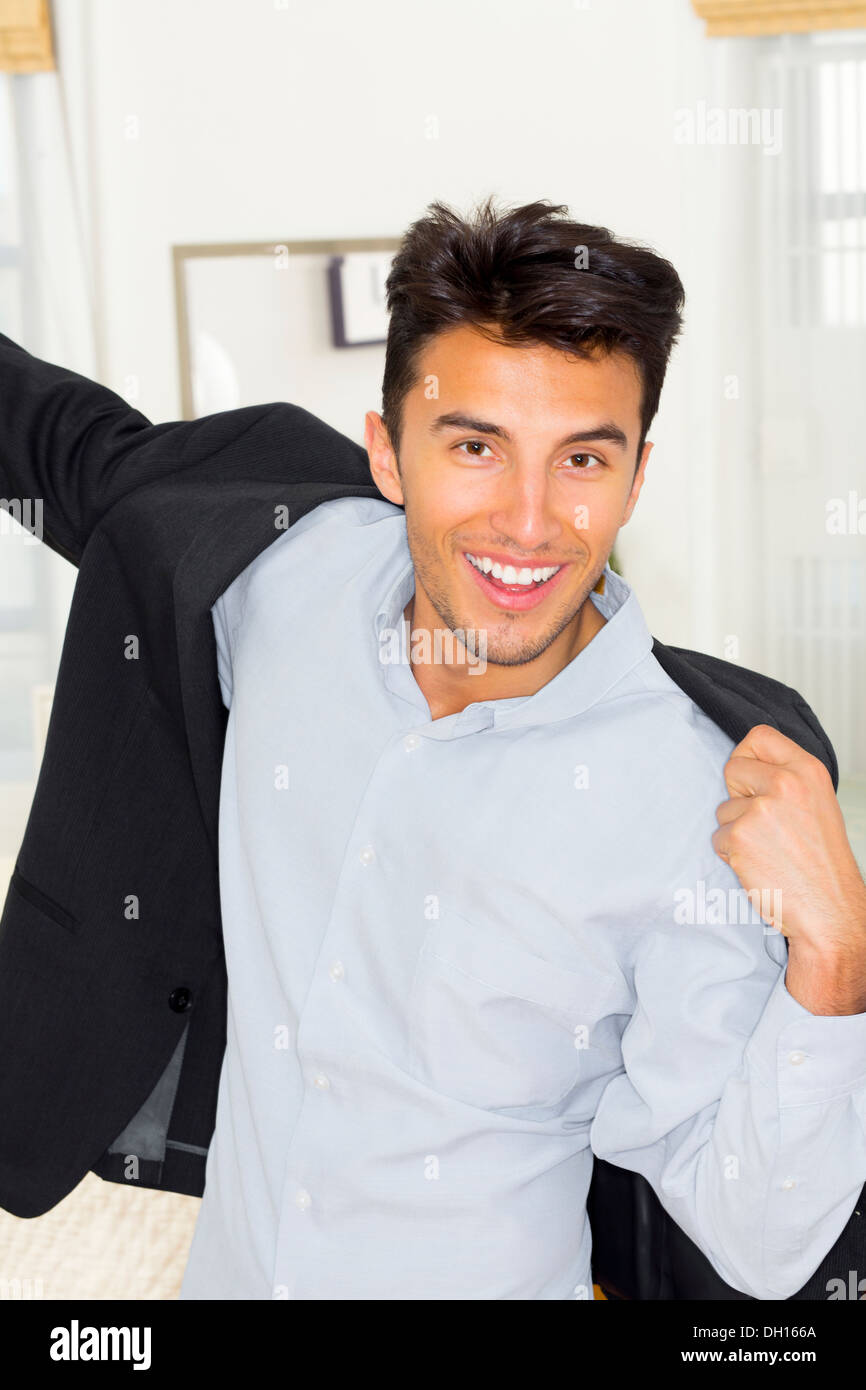 Mixed race teenager getting dressed Stock Photo