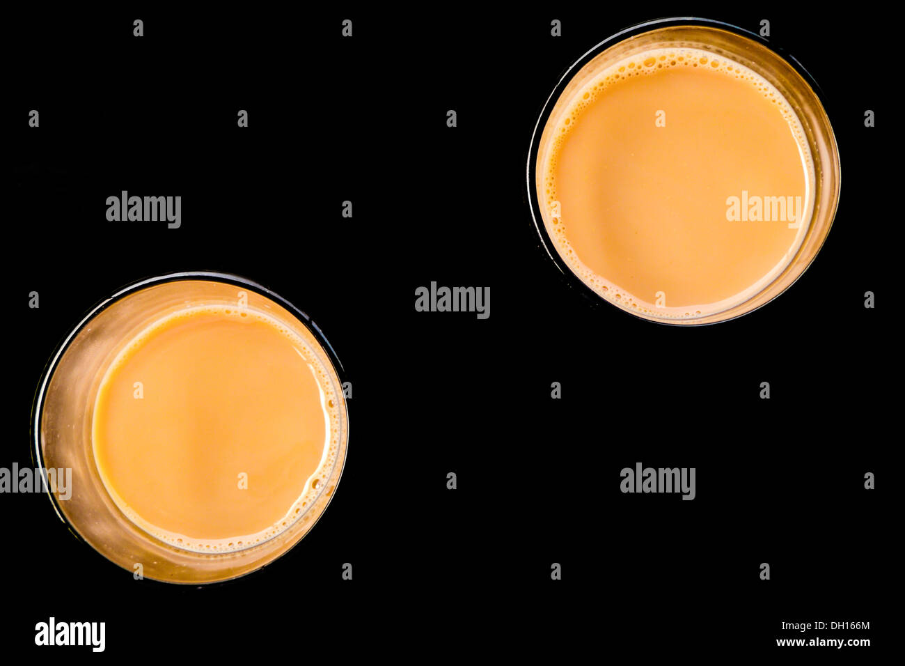 Abstract image of two cups of chai (Indian tea) brewed in a chai shop, Kerala, India Stock Photo