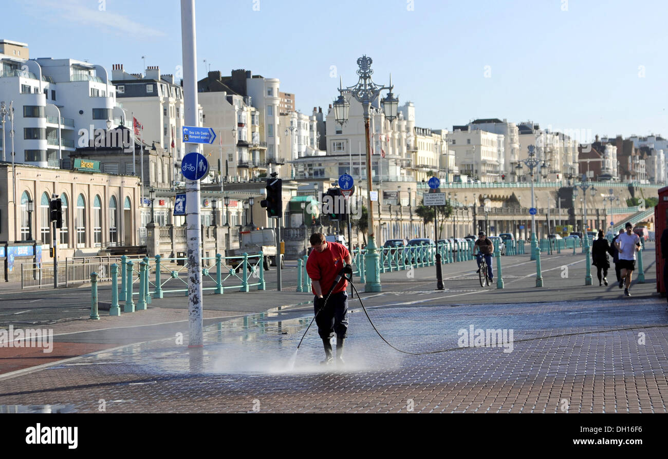 Man jet wash cleaning Brighton seafront after the storm of St Jude in ...