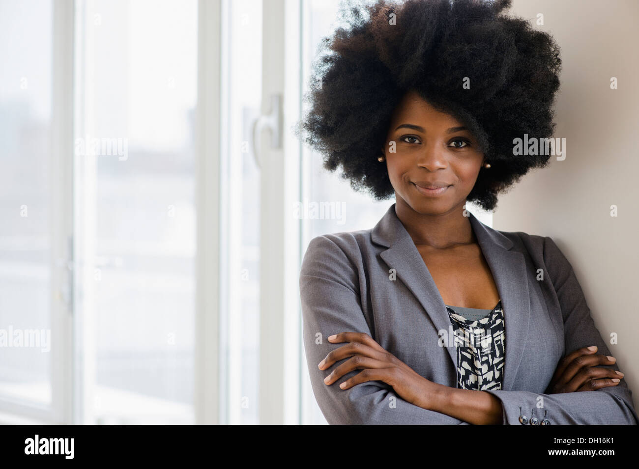 Mixed race businesswoman smiling Stock Photo