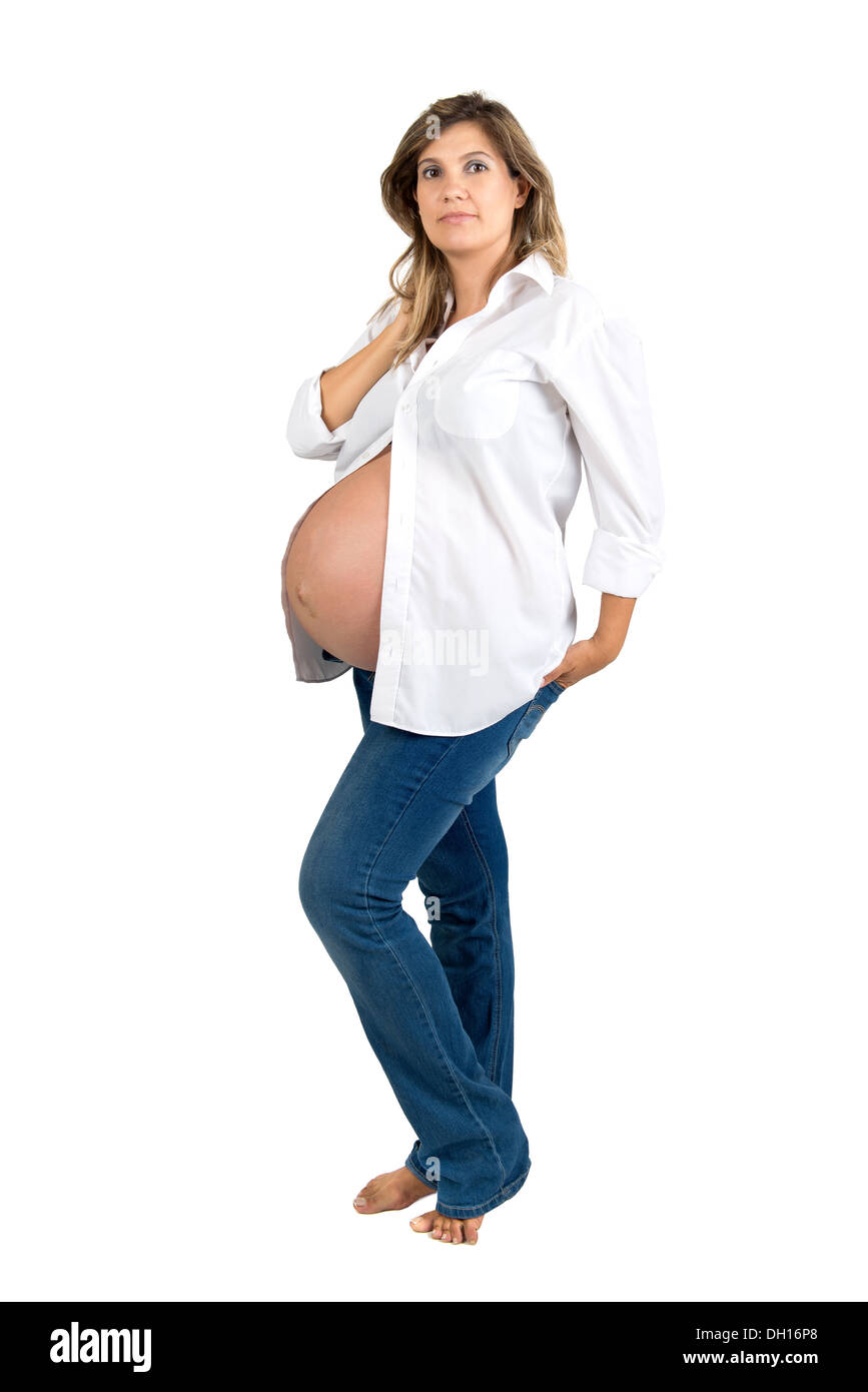 Beautiful pregnant woman in jeans and 