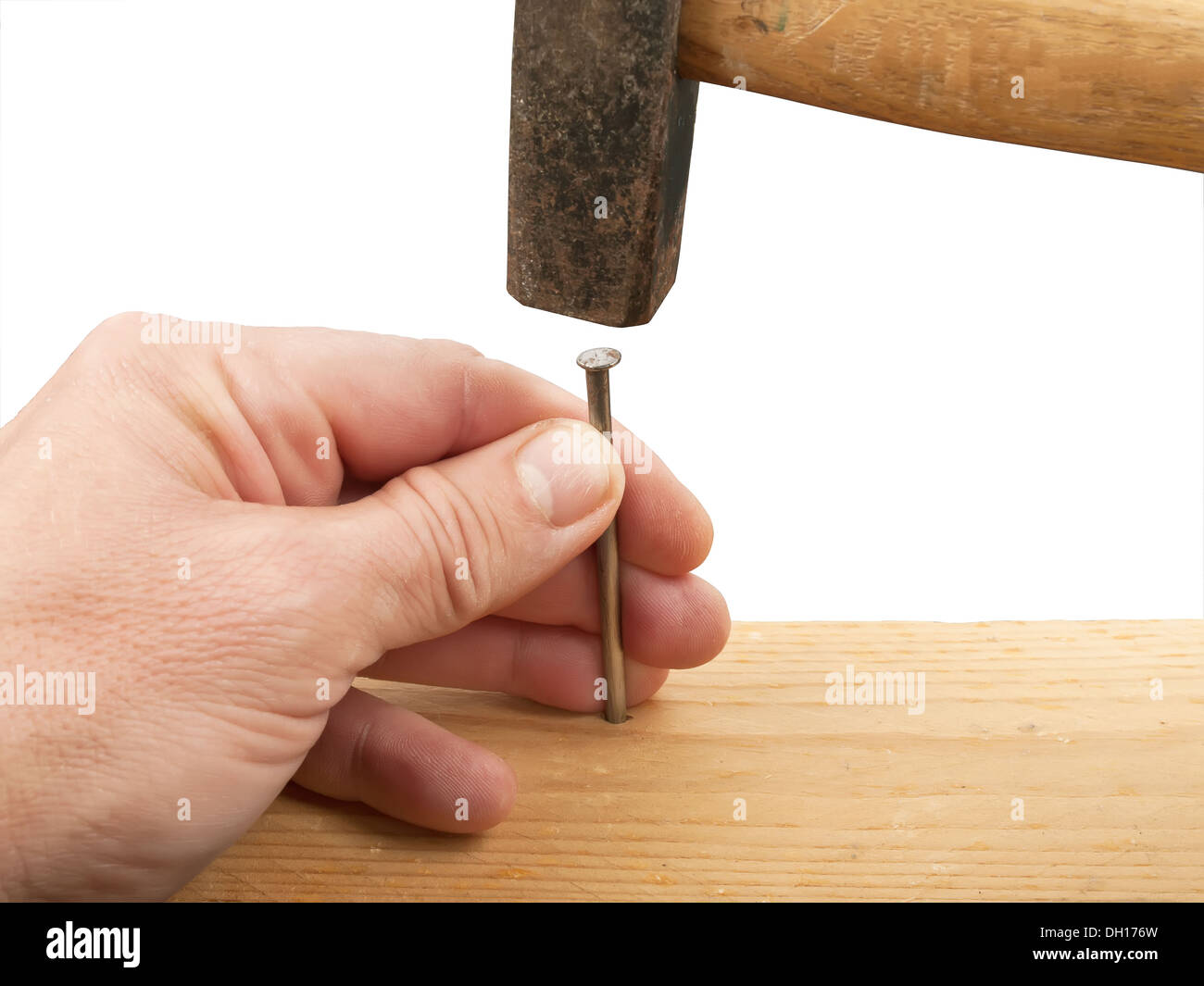 hands with hammer hitting a nail Stock Photo