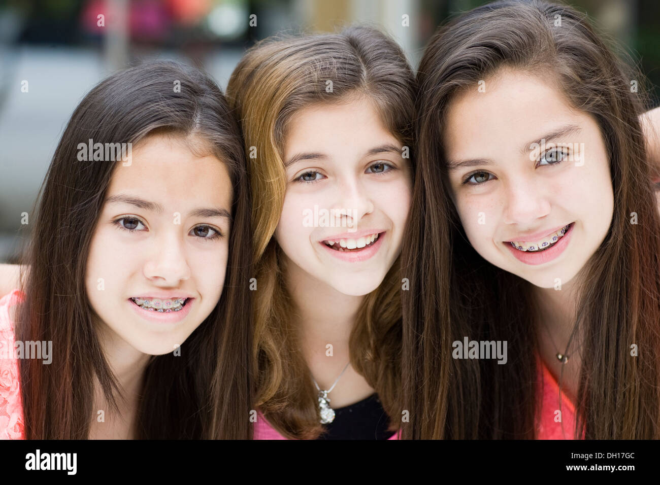 Hispanic girls smiling together Stock Photo