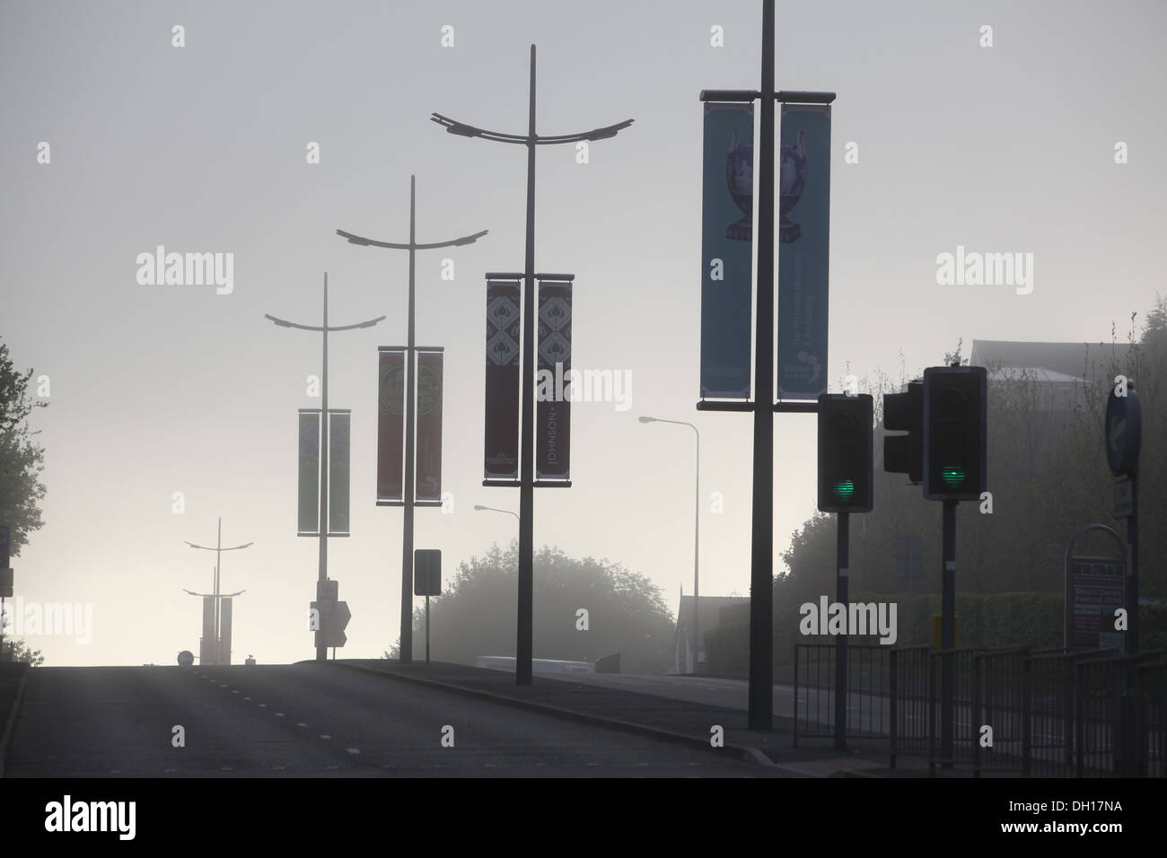 A deserted dual carriageway in Hanley Stoke on Trent - Potteries Way, decorated with banners, all quiet in the morning mist Stock Photo