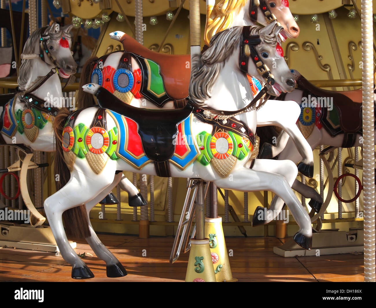 wooden horses on old carousel Stock Photo