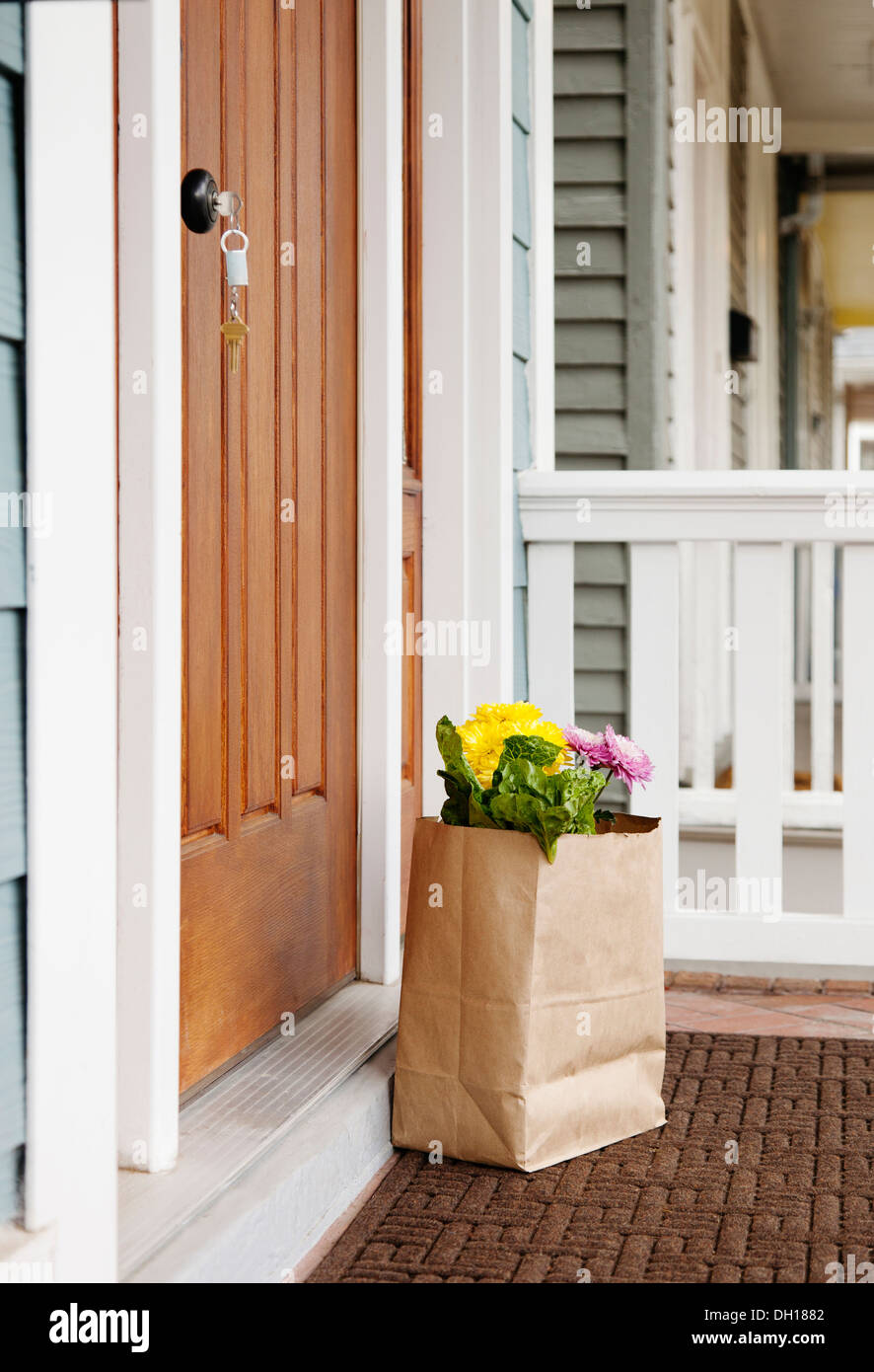 Grocery bag on front stoop Stock Photo
