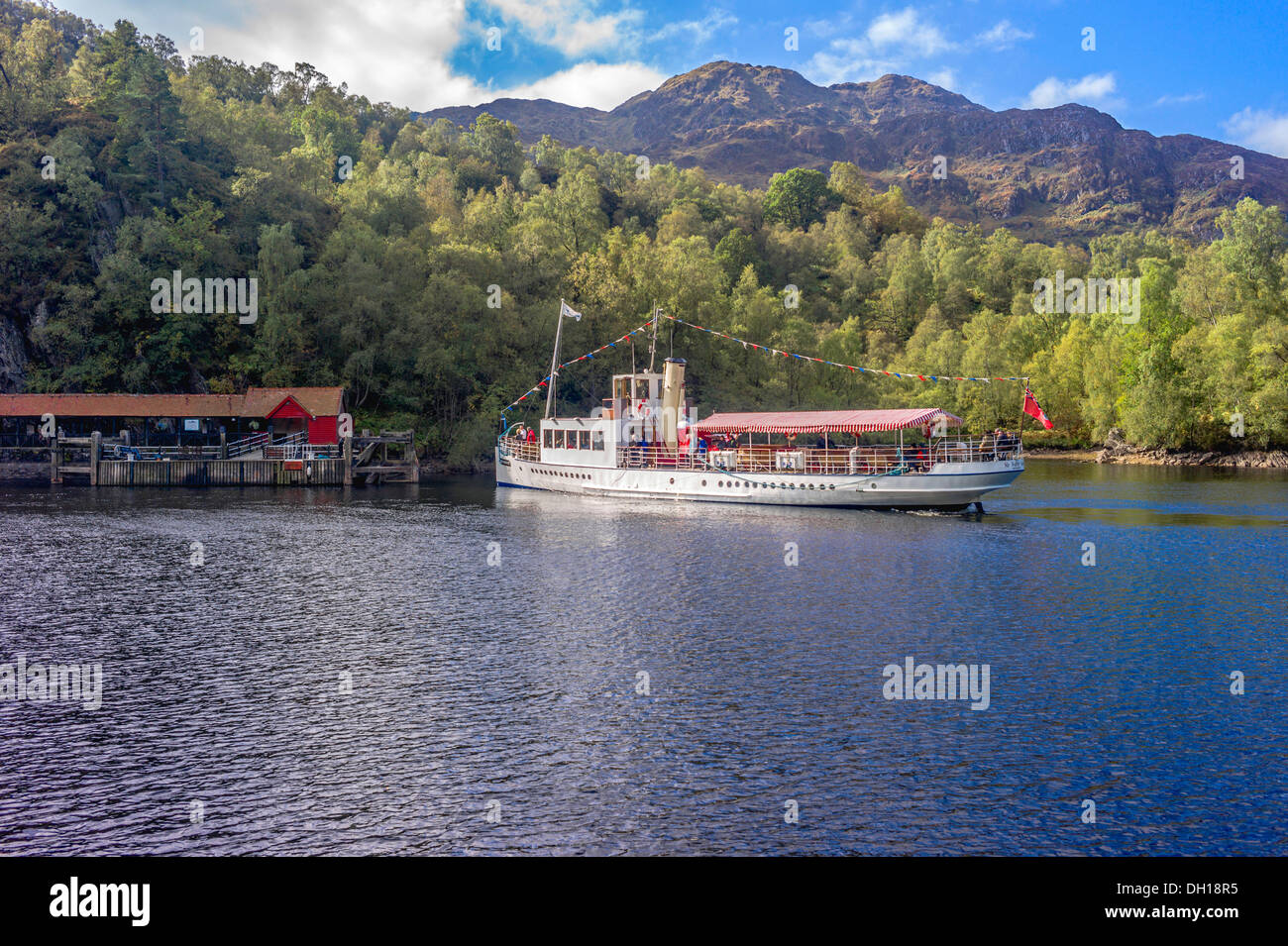 The steamship The Sir Walter Scott on Loch Katrine carrying passengers and sailing towards her berth at the Trossachs pier Stock Photo