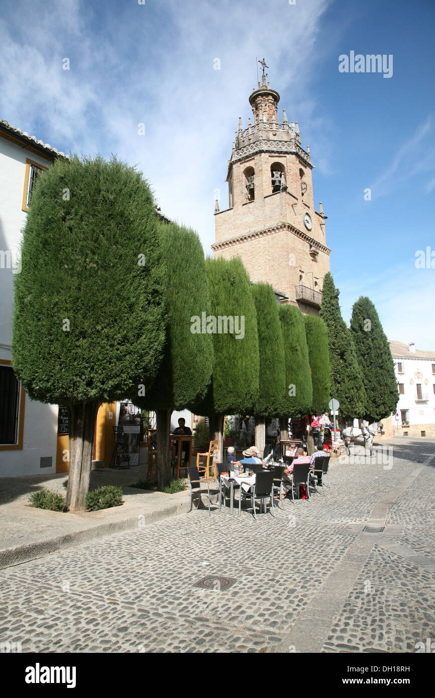 Street cafe tables by Iglesia de Santa Maria la Mayor church Ronda Spain Stock Photo