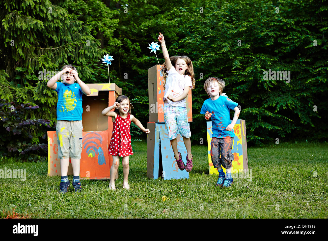 Children playing in cardboard boxes, Munich, Bavaria, Germany Stock Photo