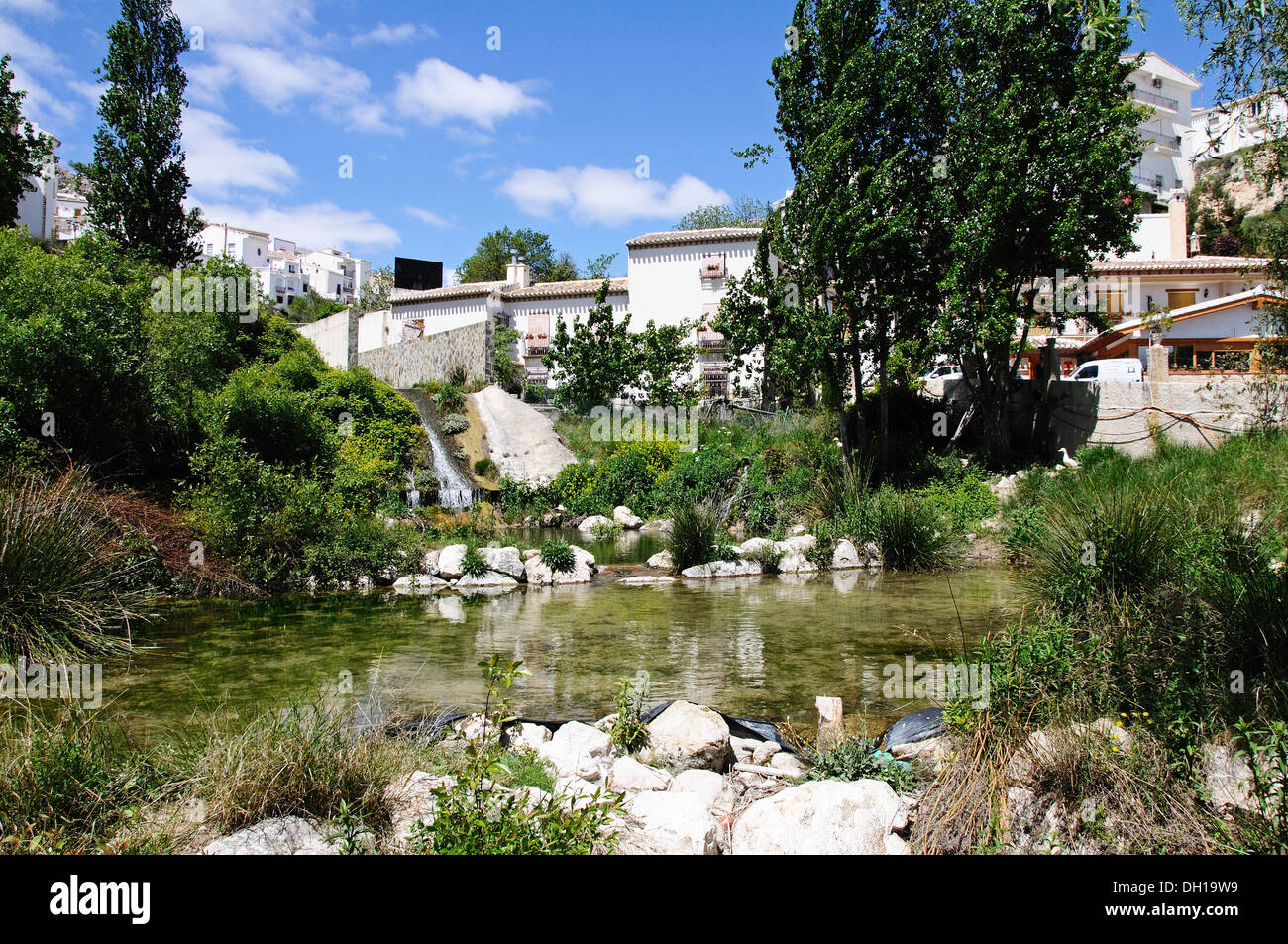 Stream through village with townhouses to the rear, Velez Blanco, Almeria Province, Andalusia, Spain, Western Europe. Stock Photo