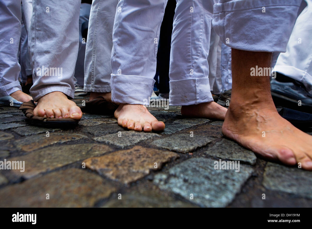 Feet of Minyons de Terrassa.'Castellers' building human tower.Fires i festes de Sant Narcis.Plaça del Vi.Girona.Spain Stock Photo