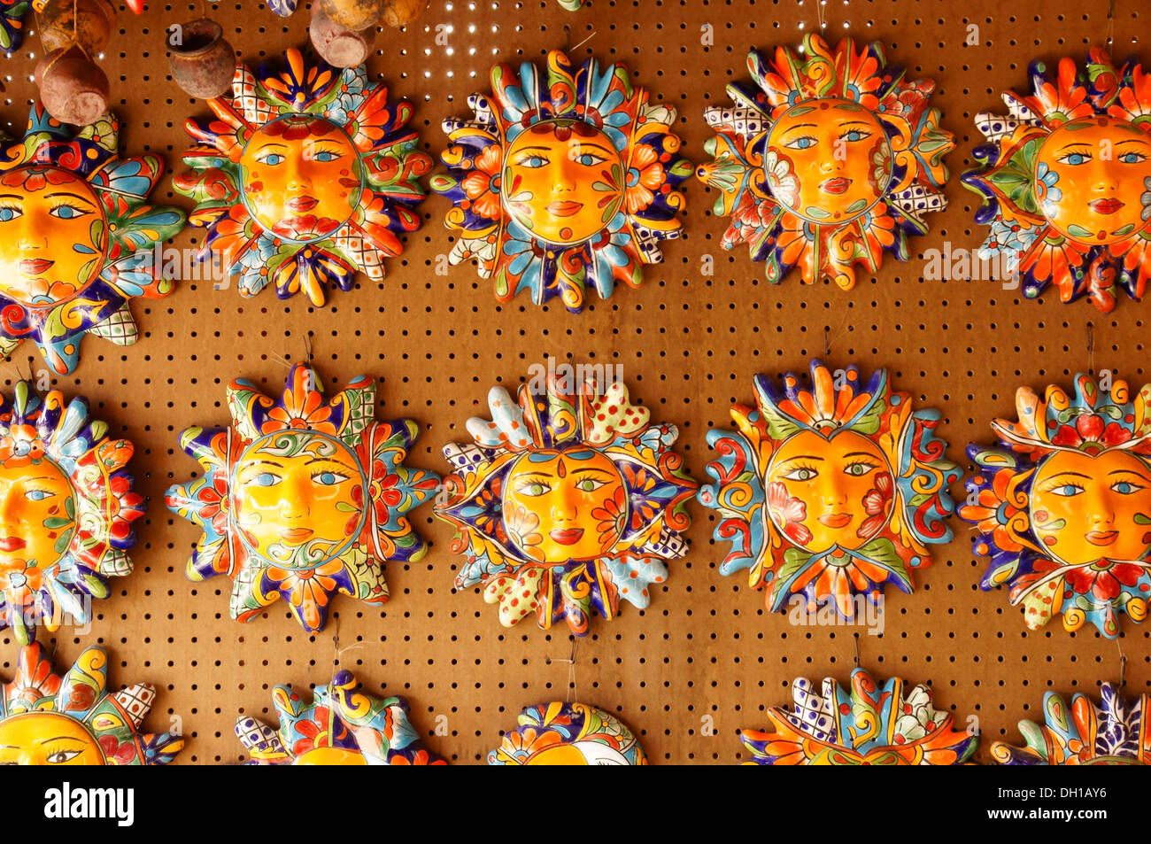 ceramic face plaques sun shine taos new mexico nm display publicize acquaint advise announce declare disclose Stock Photo