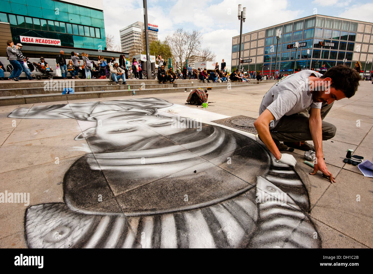 A street artist draws a portrait with chalk in Berlin Stock Photo Alamy