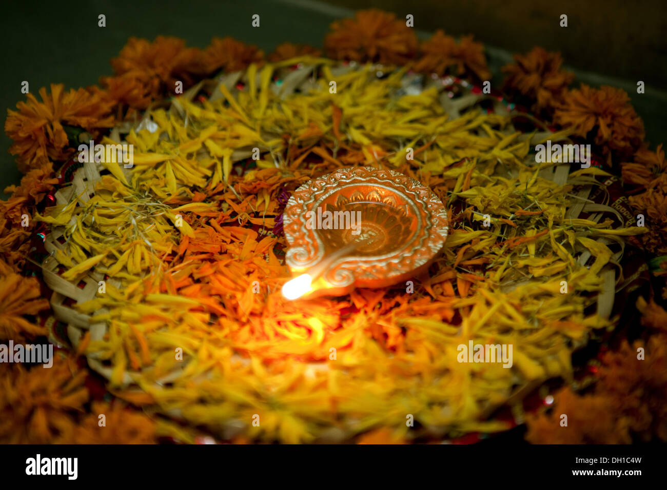 Earthen oil lamp with flower petals decoration diwali festival Mumbai Maharashtra India Asia Stock Photo