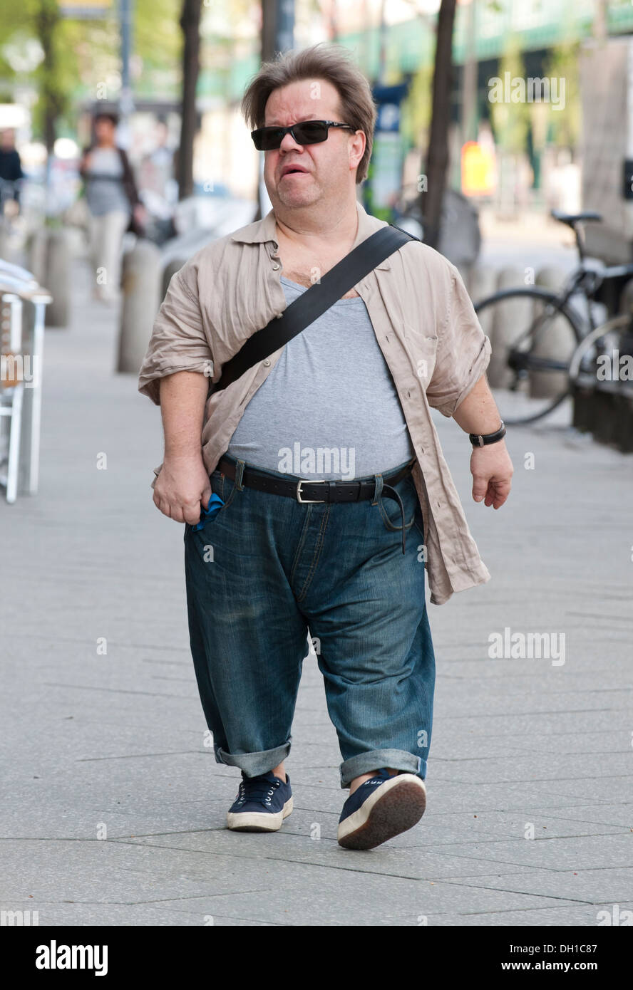 A man with dwarfism out and about in Berlin. Stock Photo
