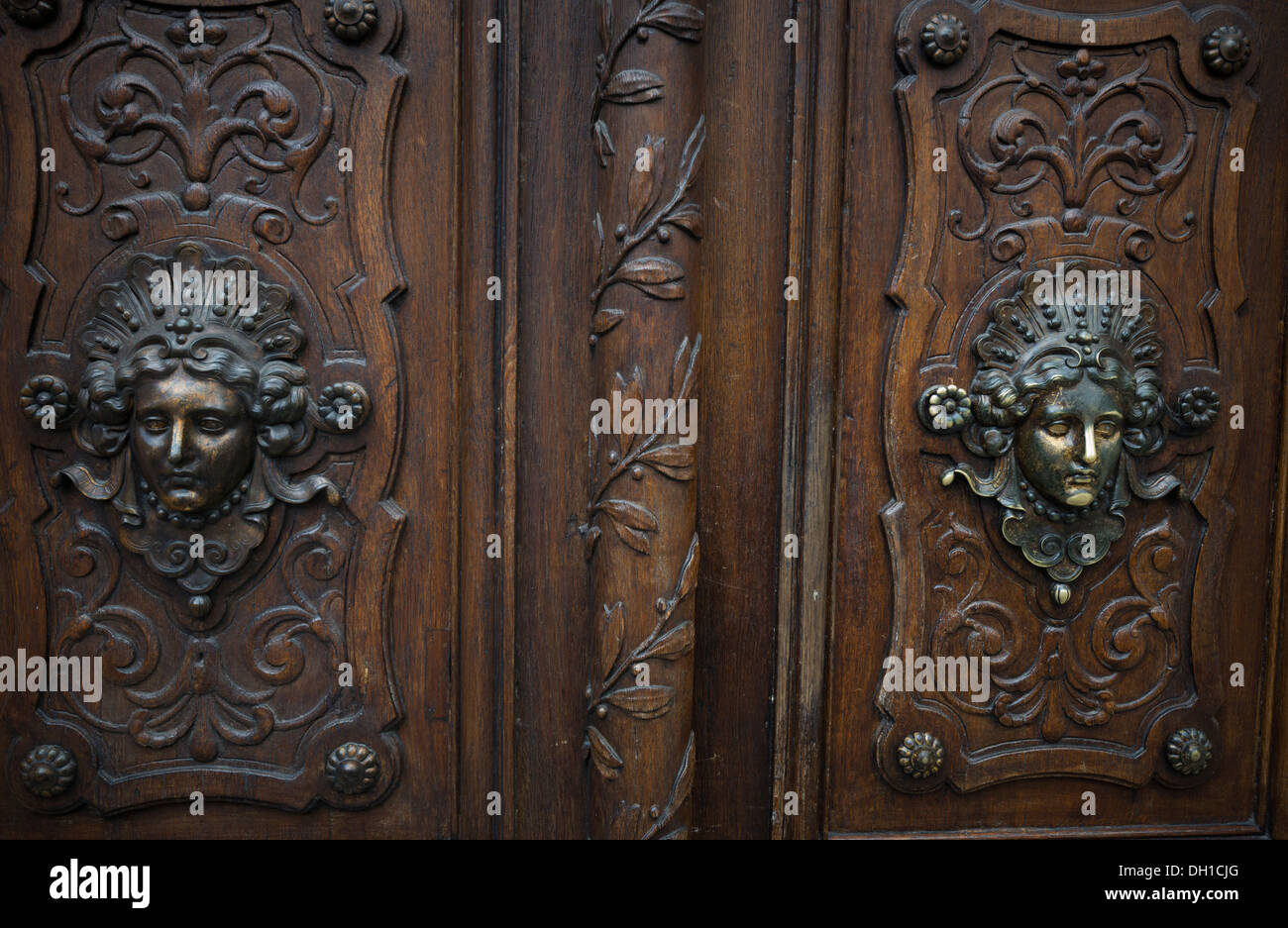 Bronze of women's face form a traditional front door decoration in Paris, France Stock Photo