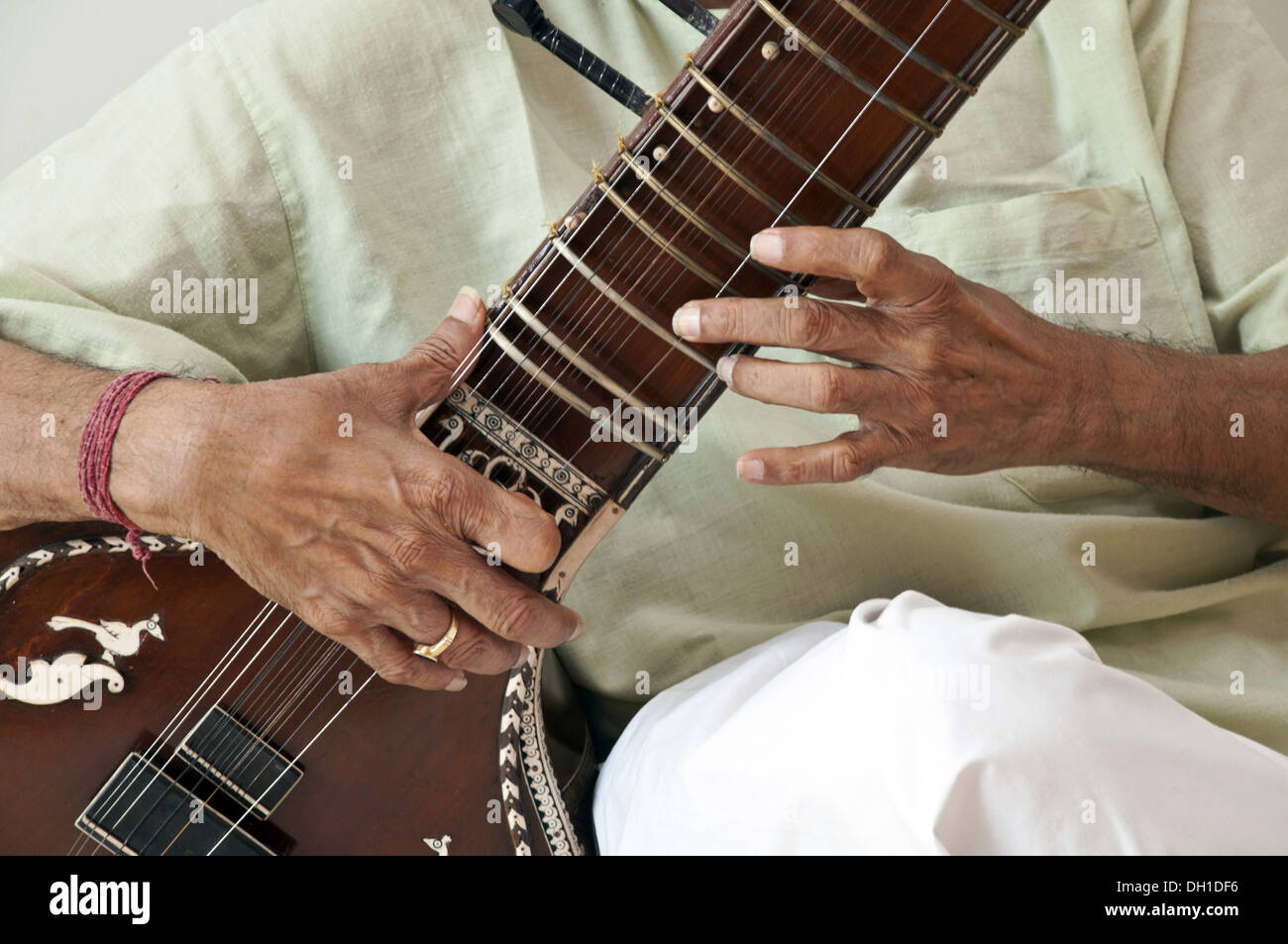 Man Playing Sitar , Indian man playing string musical instrument sitar