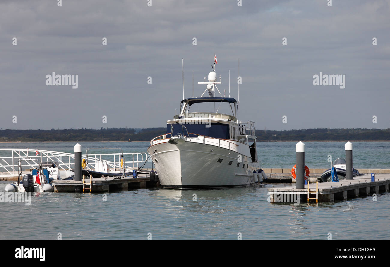 Private motor yacht moored at jetty in Solent Cowes, Isle of Wight, Hampshire, England Stock Photo