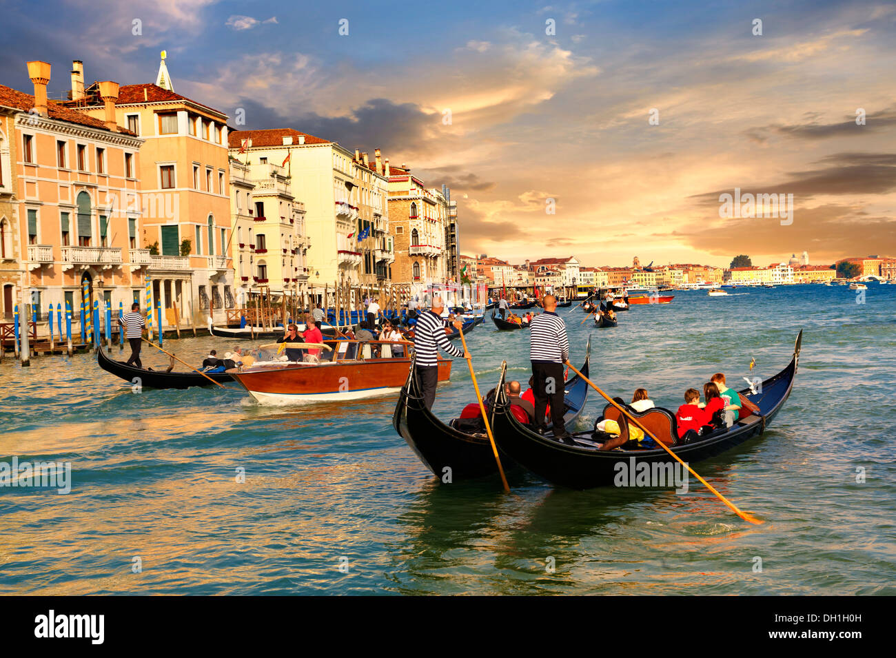 Gondolas on the Grand Canal near St Marks Square at sunset , Venice, Italy Stock Photo