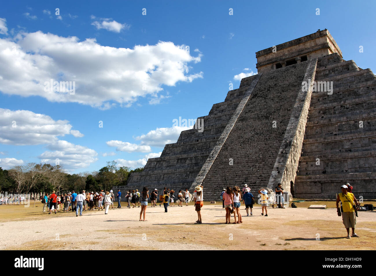 Tourists mill about Kukulkan pyramid at the ancient Mayan city of Chichen Itza, Yucatan, Mexico. Stock Photo