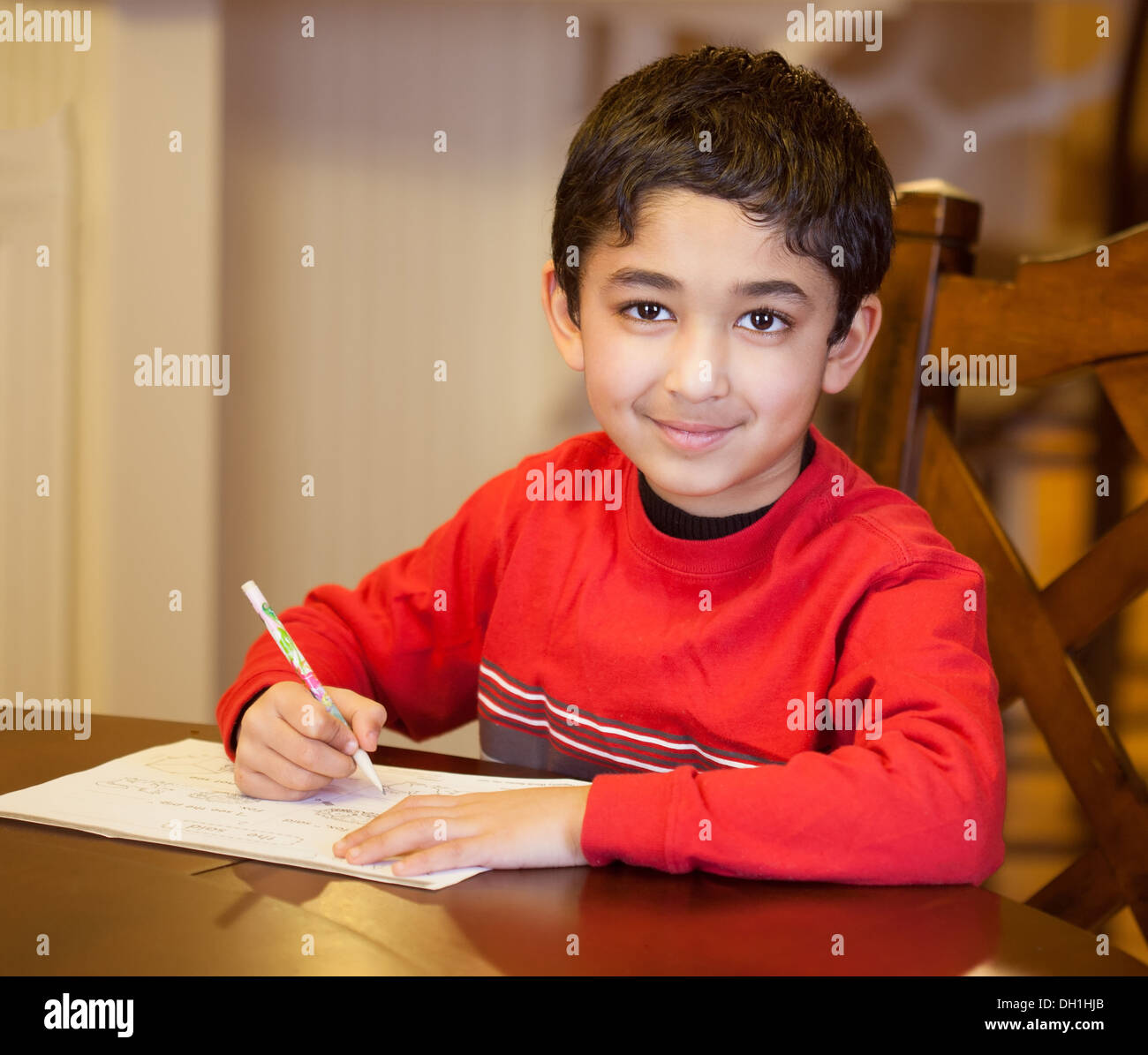 Boy doing homework asian hi res stock photography and images alamy