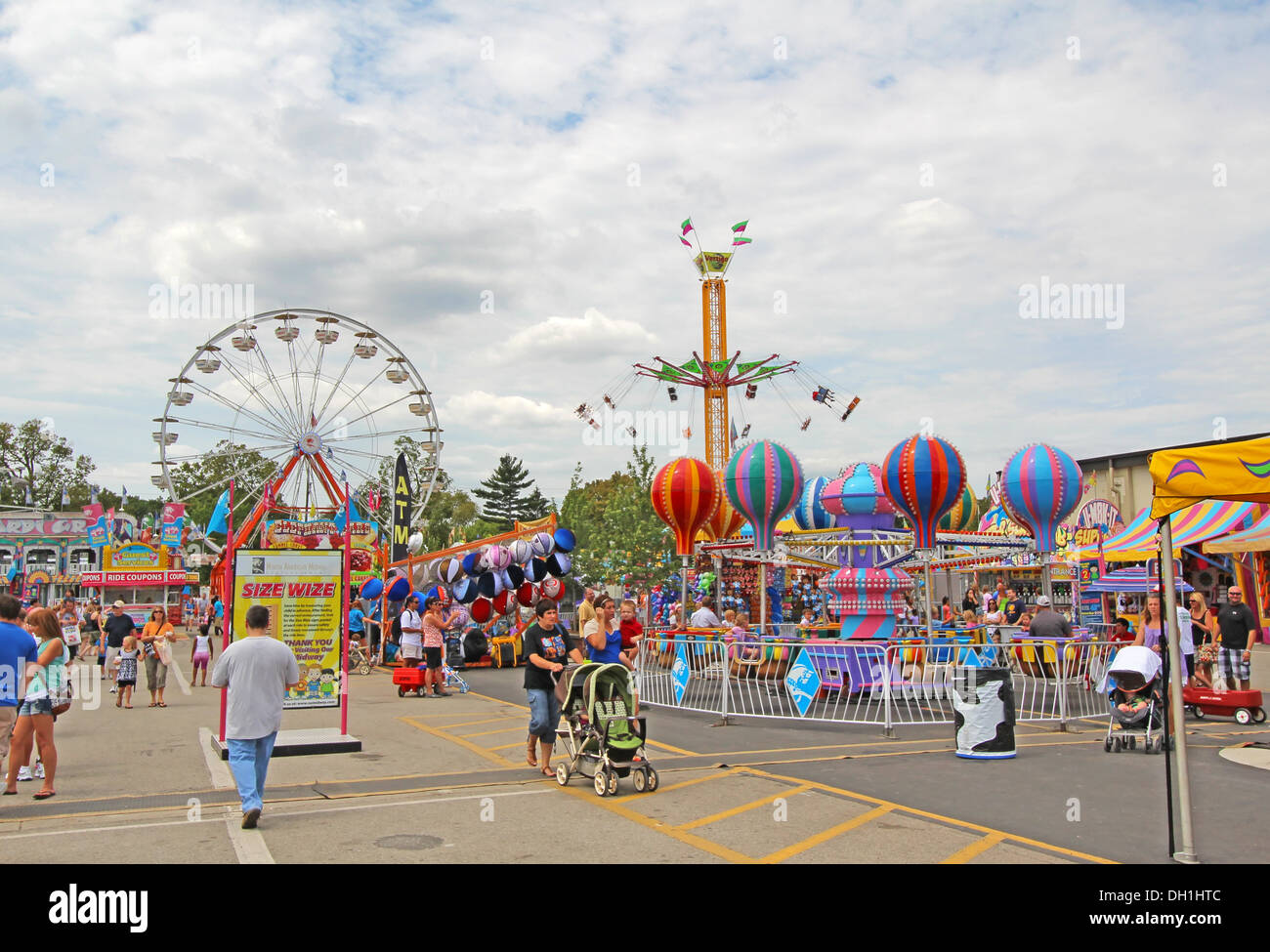 Tourists and rides on the Midway at the Indiana State Fair in